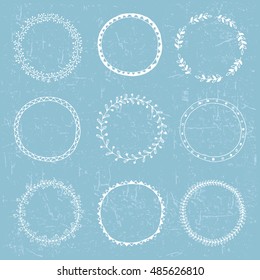 Hand drawing logo design with wreath and floral elements 