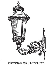 Hand drawing old street lamp. Vector monochrome illustration in black color isolated on white background.