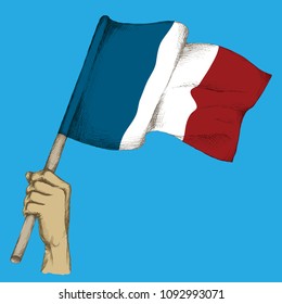 Hand drawing, sketch. French flag in hand, the state colors of France on a neutral background.