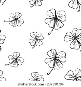 Hand drawing symbols of luck seamless pattern. Vector background with clover and quatrefoil on white background. Chess grid order