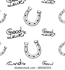 Hand drawing symbols of luck seamless pattern. Vector background with slogan and horseshoe on white background. Chess grid order