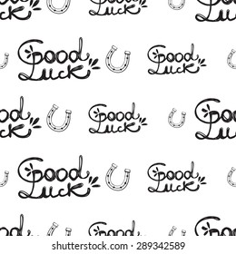 Hand drawing symbols of luck seamless pattern. Vector background with slogan and horseshoe on white background. Chess grid order