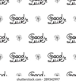 Hand drawing symbols of luck seamless pattern. Vector background with slogan and clover on white background. Chess grid order