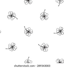 Hand drawing symbols of luck seamless pattern. Vector background with quatrefoil on white background. Chess grid order