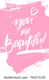 Hand drawing you are beautiful calligraphy text on pink grunge brushing background