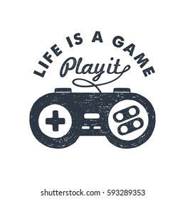 Hand drawn 90s themed badge with gamepad textured vector illustration and "Life is a game. Play it!" inspirational lettering.