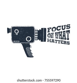 Hand drawn 90s themed badge with camcorder vector illustration and "Focus on what matters" inspirational lettering.