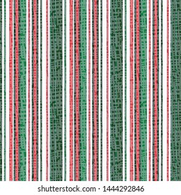 Hand drawn abstract Christmas stripes seamless pattern. Textured vertical striped background. Winter holiday all over print. Festive gift wrapping paper , decor packaging illustration. Vector swatch.