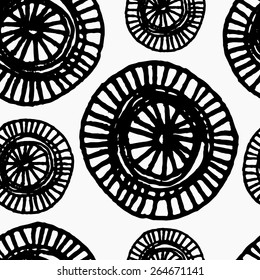 Hand drawn abstract seamless repeat pattern with ornate round shapes in black and white.