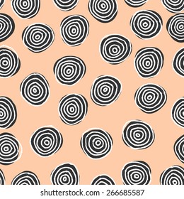Hand drawn abstract seamless repeat pattern with round shapes in black and white on a pastel pink background.