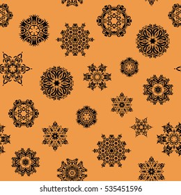 Hand drawn abstract snowflakes seamless. Template for cover, poster, t-shirt or fabric. Vector winter illustration in orange colors.