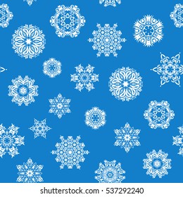 Hand drawn abstract snowflakes seamless. Template for cover, poster, t-shirt or fabric. Vector winter illustration in blue colors.