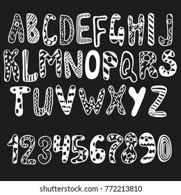 Hand drawn alphabet and numbers. Lettering. Unique font. Letters and numbers for birthday, holidays greeting. Chalk lettering on black board.