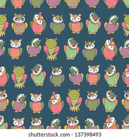 Hand drawn amusing cartoon owls seamless pattern. Motley endless background
