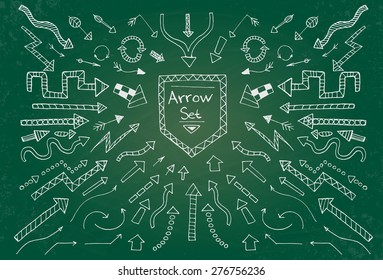 Hand drawn arrow icons set on black chalk board. Vector Illustration