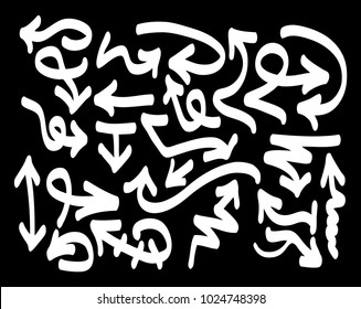 Hand drawn arrows set on a black background. Vector art.