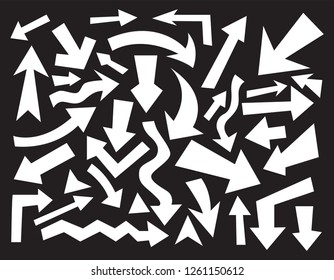 Hand drawn arrows. Vector icons set on black background.