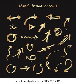 Hand drawn arrows.Golden arrows set.Vector illustration.