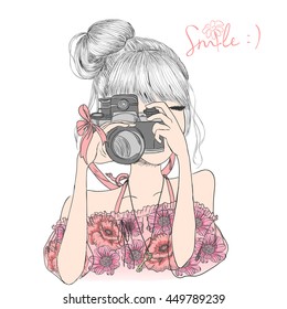 Hand drawn beautiful cute girl in a floral dress with camera in his hands. Vector illustration.