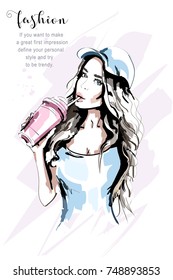 Hand drawn beautiful woman portrait. Fashion woman in cap. Stylish girl with coffee mug. Sketch.