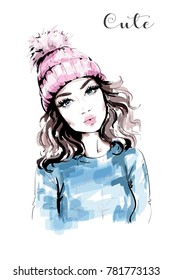 Hand drawn beautiful woman portrait. Fashion woman in knitted hat with pompom. Stylish look. Fashion girl. Sketch. 
