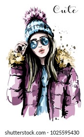 Hand drawn beautiful young woman in knit hat. Fashion woman in sunglasses. Stylish girl. Sketch. 