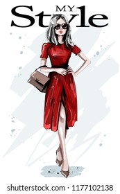 Hand drawn beautiful young woman in red dress. Stylish elegant girl with bag. Fashion woman outfit. Sketch.