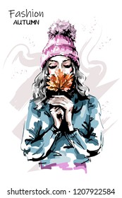 Hand drawn beautiful young woman holding autumn leaf. Stylish elegant girl. Fashion woman portrait. Sketch.