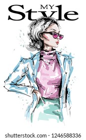 Hand drawn beautiful young woman in sunglasses. Stylish elegant girl fashion look. Fashion woman portrait. Sketch.