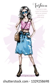 Hand drawn beautiful young woman with bag. Stylish girl in jeans skirt. Fashion woman look. Sketch.