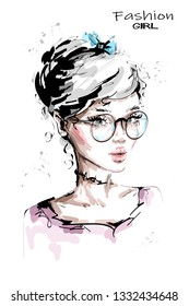 Hand drawn beautiful young woman in eyeglasses. Stylish girl with bow in her blonde hair. Fashion woman look. Sketch. Vector illustration.