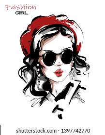 Hand drawn beautiful young woman in red beret. Stylish girl in sunglasses. Fashion woman look. Sketch. Vector illustration.