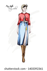 Hand drawn beautiful young woman in skirt and blouse. Stylish autumn outfit. Fashion woman look. Fashion model posing. Sketch