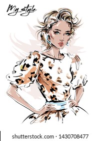 Hand drawn beautiful young woman in dress with leopard print. Stylish girl. Fashion woman look. Sketch. Vector illustration.