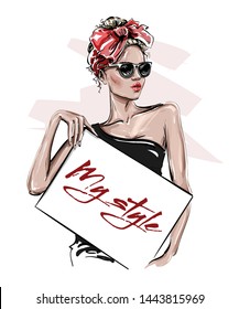 Hand drawn beautiful young woman in sunglasses holding poster. Stylish girl with bow on her head. Fashion woman look. Sketch. Vector illustration.