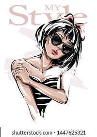 Hand drawn beautiful young woman in sunglasses. Stylish girl. Fashion woman look. Sketch. Vector illustration.