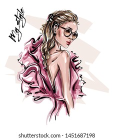 Hand drawn beautiful young woman in sunglasses. Stylish girl in pink dress. Fashion woman look. Sketch. Vector illustration.