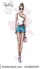 Hand drawn beautiful young woman in sunglasses. Fashion female outfit. Stylish girl in jeans shorts. Fashion woman look. Sketch. Vector illustration.