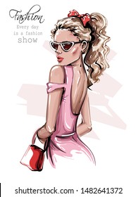 Hand drawn beautiful young woman in sunglasses. Stylish girl with bag. Fashion woman look. Fashion girl with bow on her head. Sketch. Vector illustration.