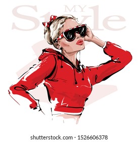 Hand drawn beautiful young woman in sunglasses. Stylish girl in red sweatshirt. Fashion woman look. Vector illustration.