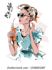 Hand drawn beautiful young woman with bottle of juice. Stylish girl in sunglasses. Fashion woman look. Sketch. Vector illustration.