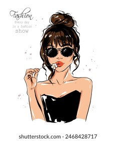 Hand drawn beautiful young woman in sunglasses. Stylish girl with hair bun. Fashion woman holding flower. Sketch. Vector illustration.