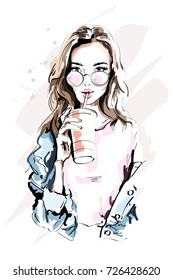Hand drawn beautiful young woman portrait. Fashion girl with coffee cup. Stylish woman in sunglasses. Sketch.