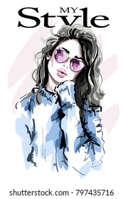 Hand drawn beautiful young woman in sunglasses. Fashion woman. Sketch. Vector illustration.