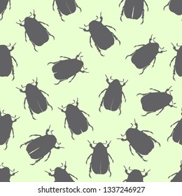 Hand drawn beetle silhouette pattern. Beetles on green background. Vector illustration. For paper, fabric, banner, 
wrapping paper.