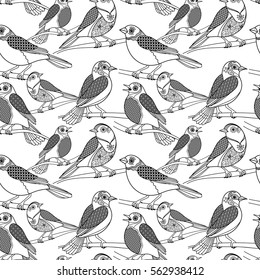 Hand drawn birds seamless pattern. Vector black contour birds with floral patterns