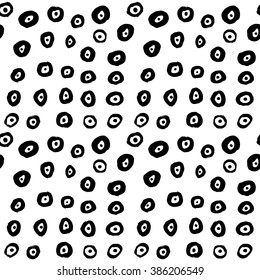 Hand drawn black brush circles and dots seamless pattern, vector illustration.
