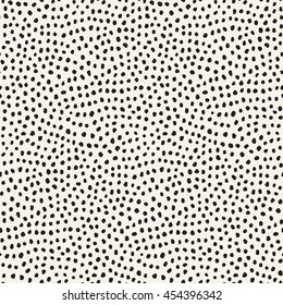 Hand drawn black dots on white background. Vector seamless pattern