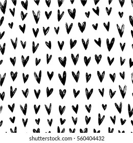 Hand drawn black hearts with rough edges seamless pattern.