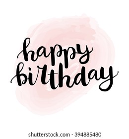 Hand drawn black ink brush lettering "Happy birthday" isolation on light pink watercolor background. Vector calligraphy for your design: greeting cards, banners, gift tags and etc.